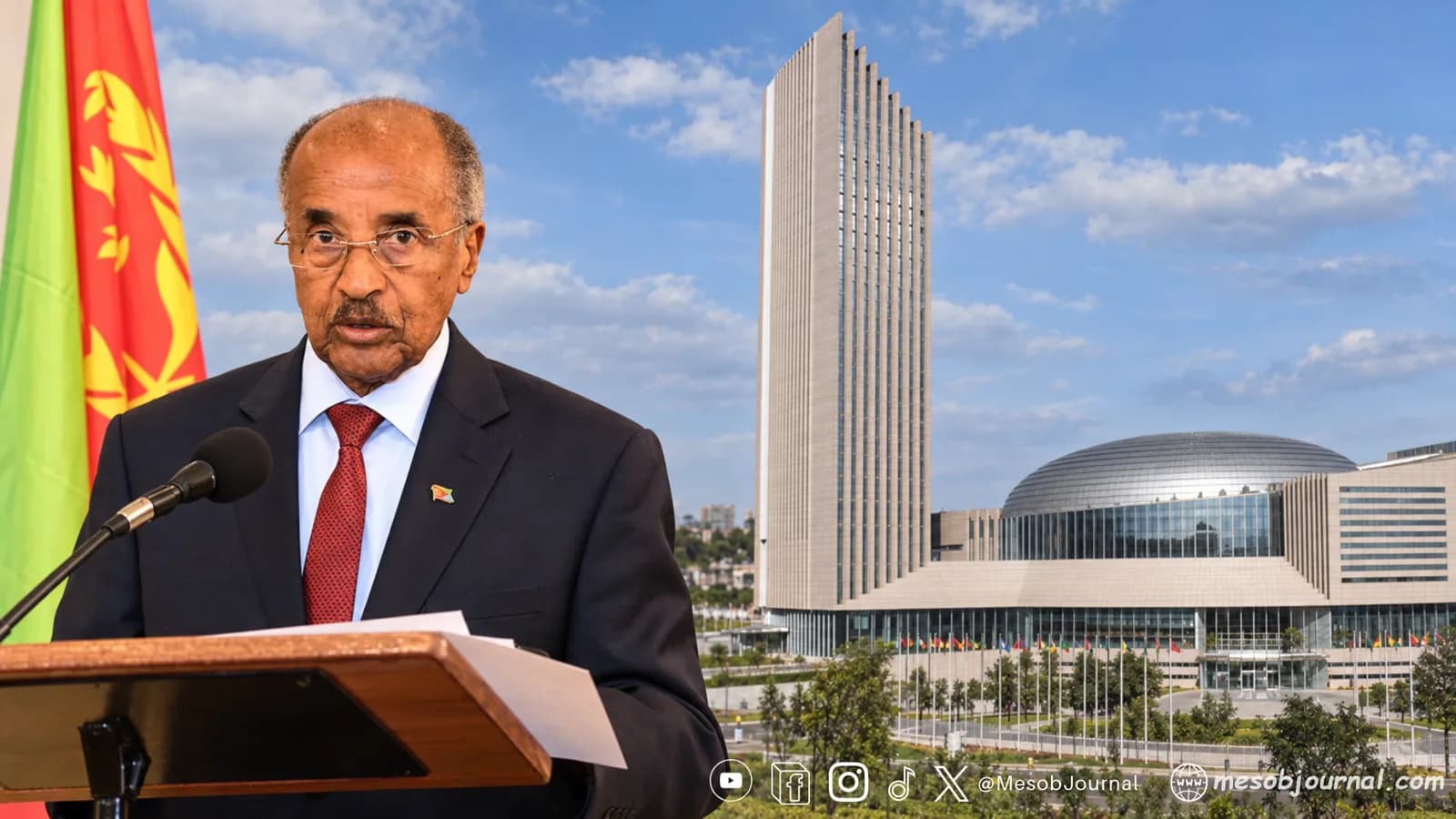 Eritrean FM at a lectern beside Eritrea’s flag, with African Union headquarters in the background.