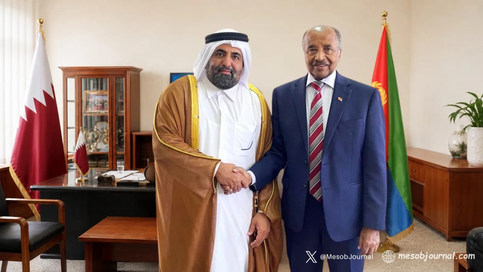Eritrean and Qatari officials shaking hands in Asmara.